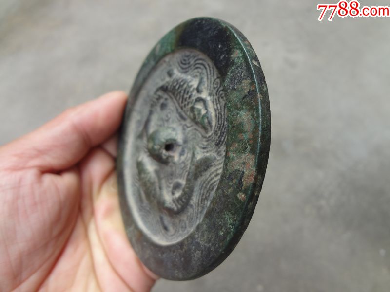 金代名版"双鱼"纹镜子一面