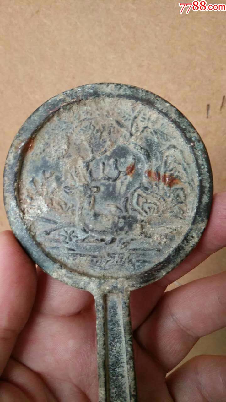 带柄的铜镜
