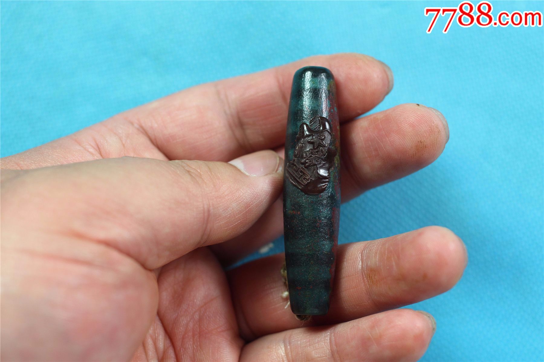 文物商店库存一颗万字纹朱砂天珠