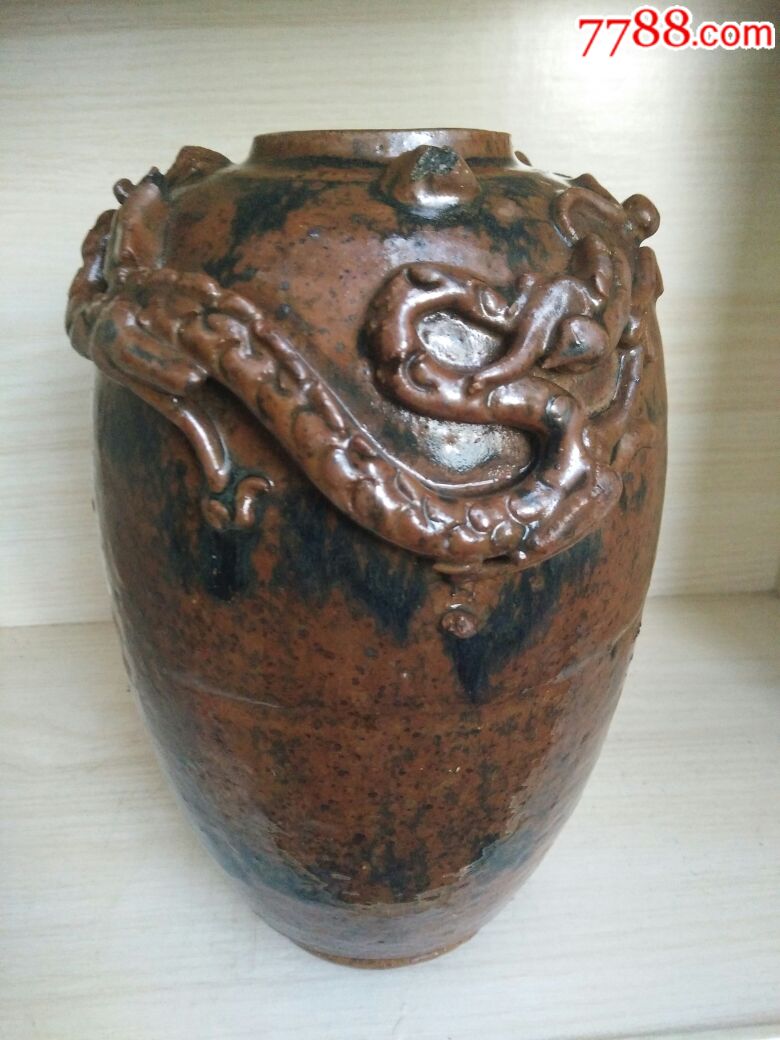 四川宋代黑釉龙纹陶罐图片
