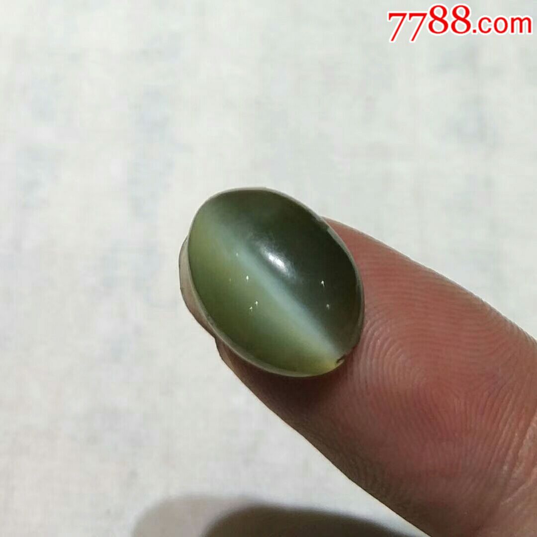 老猫眼石戒面,造型精致,工艺一流,长1.5厘米