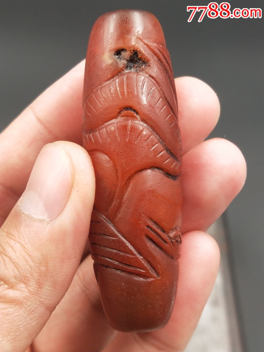 辽金时期酒红玛瑙勒子