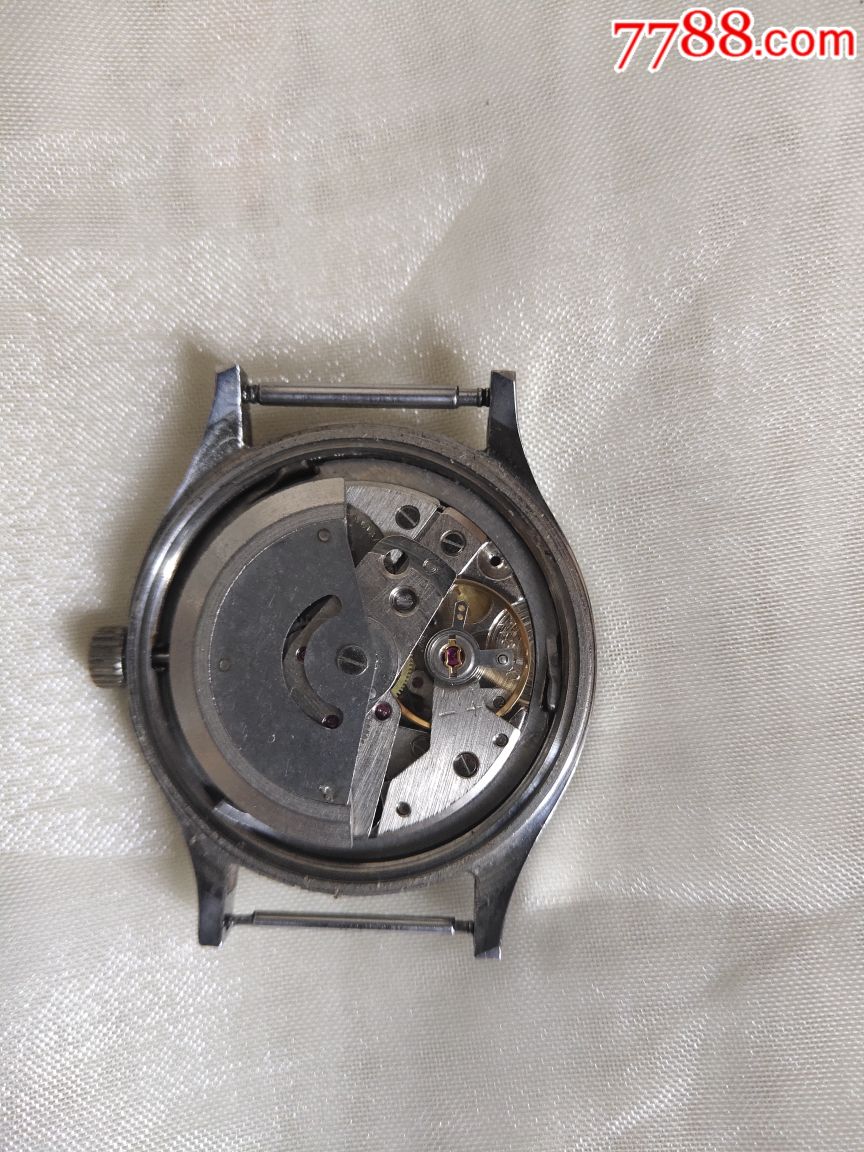 辽宁手表厂孔雀牌33钻单历自动男表