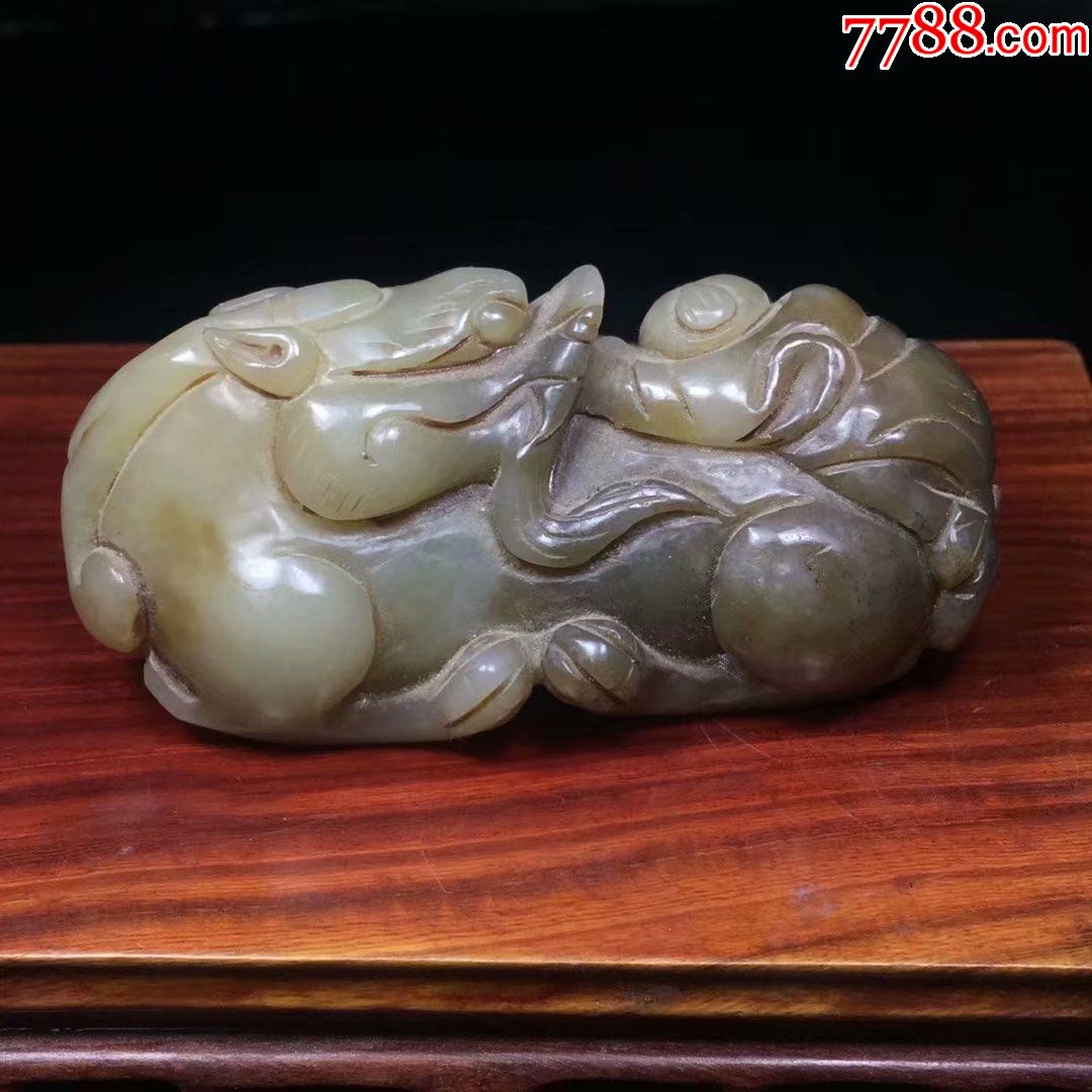 清代和田玉麒麟送子手把件