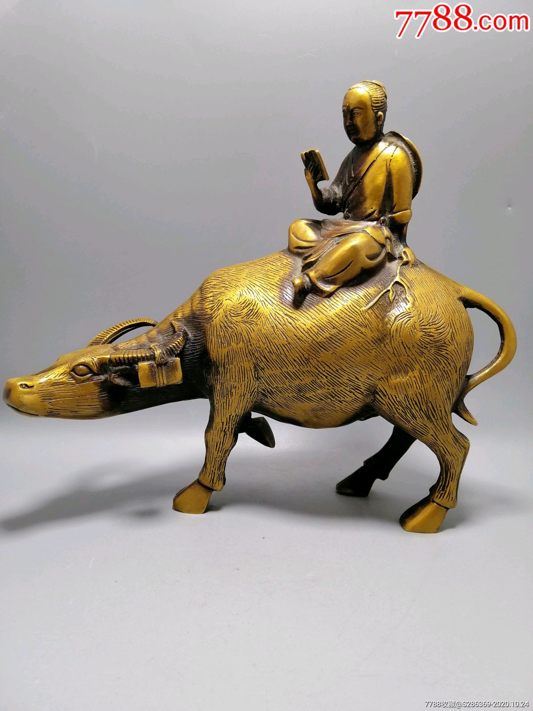 工艺品骑牛看书