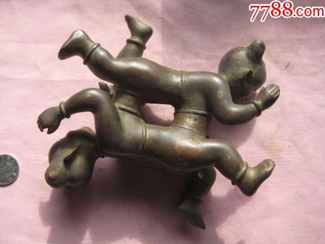 一个漂亮的民国四喜童子铜镇纸