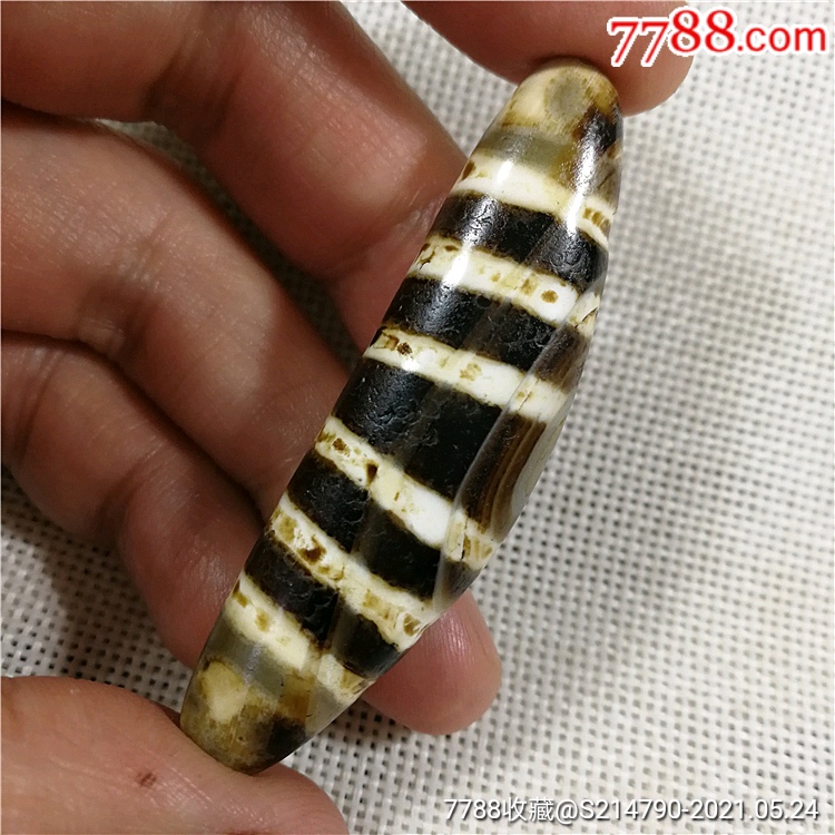 藏传六线牛角玛瑙天珠【宝贝尺寸】:长58宽16毫米左右【收藏逼格】:1