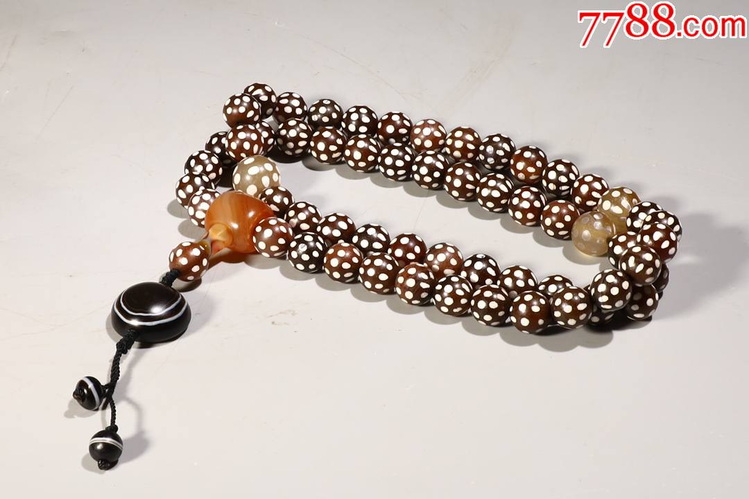 玛瑙羊眼天珠手持